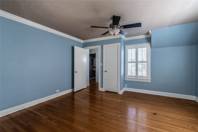 unfurnished bedroom featuring hardwood / wood-style flooring, a textured ceiling, ceiling fan, and crown molding