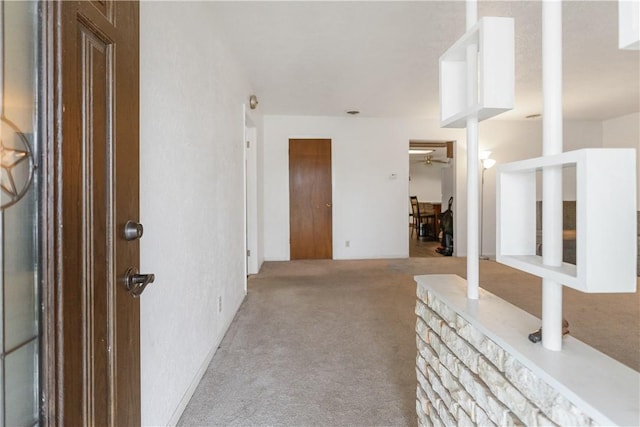 view of carpeted foyer