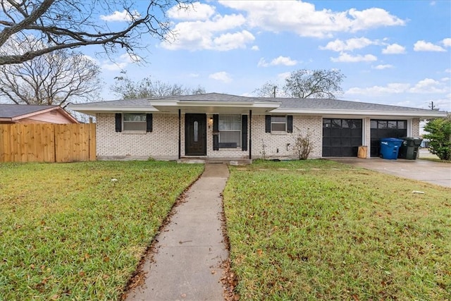 view of front of house featuring a front yard and a garage