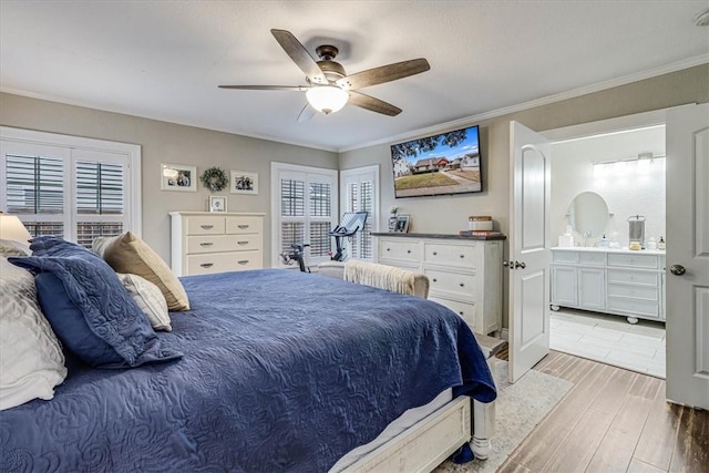 bedroom with ceiling fan, ornamental molding, and ensuite bathroom