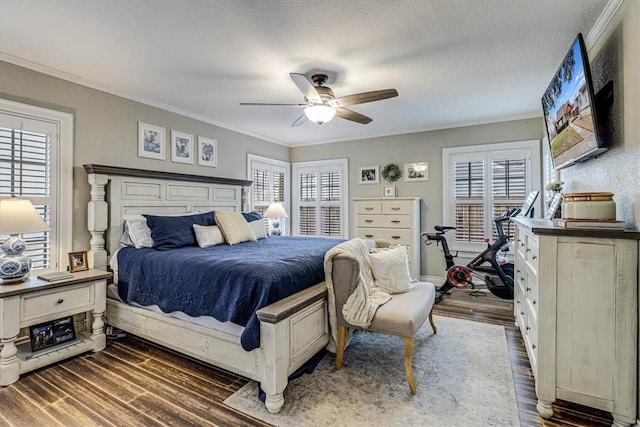 bedroom with ceiling fan, ornamental molding, dark hardwood / wood-style flooring, and a textured ceiling