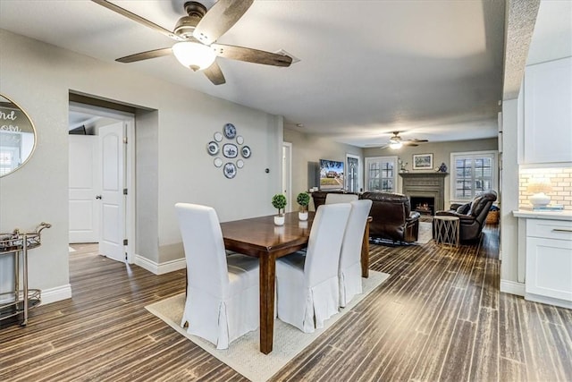 dining room with dark hardwood / wood-style floors and ceiling fan