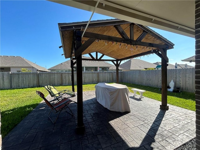 view of patio / terrace with a gazebo and grilling area