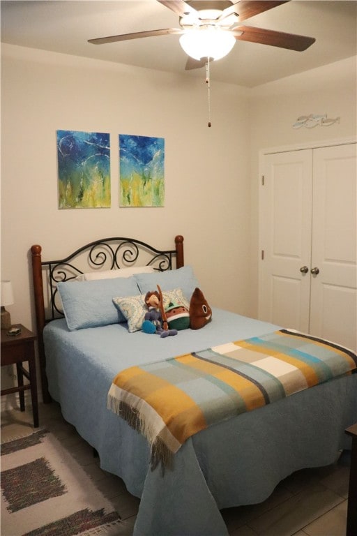 bedroom featuring a closet and ceiling fan