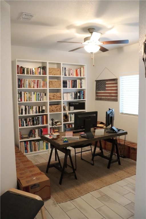 office area with ceiling fan and light wood-type flooring