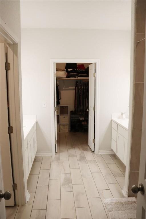 bathroom with tile patterned flooring and vanity