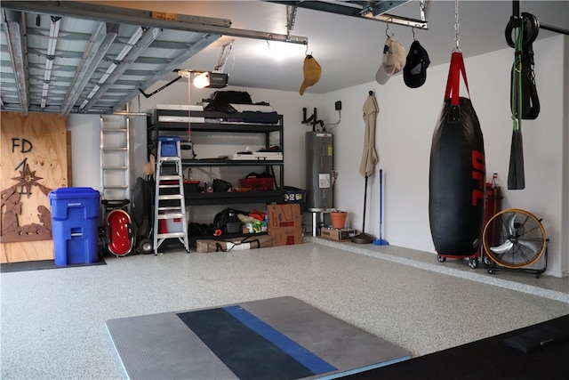 garage featuring electric water heater and a garage door opener