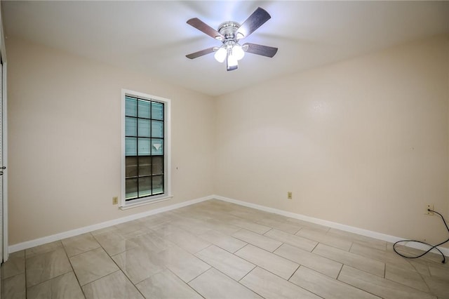 unfurnished room with ceiling fan