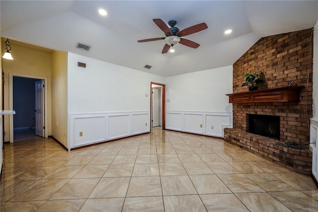 unfurnished living room featuring a brick fireplace, ceiling fan, and lofted ceiling