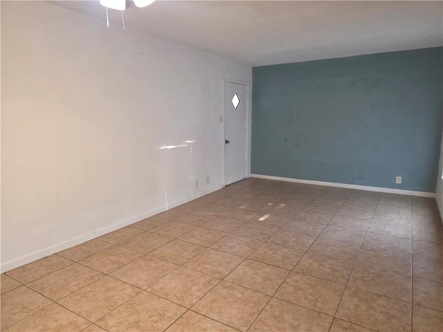 4513 Carroll, Corpus Christi, TX 78415 - unfurnished room featuring ceiling fan, light tile patterned flooring, and baseboards