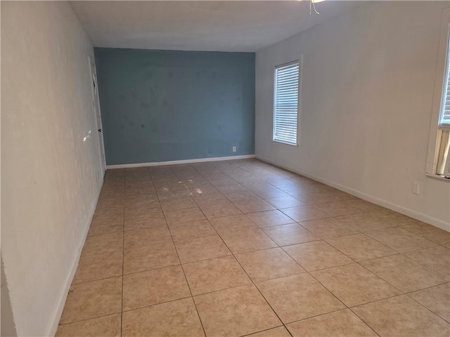 4513 Carroll, Corpus Christi, TX 78415 - tiled empty room with ceiling fan and baseboards