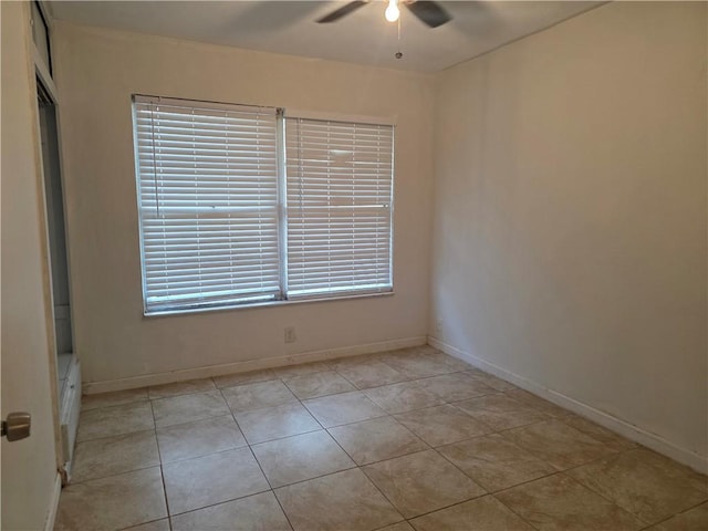 4513 Carroll, Corpus Christi, TX 78415 - spare room featuring a ceiling fan, baseboards, and light tile patterned floors