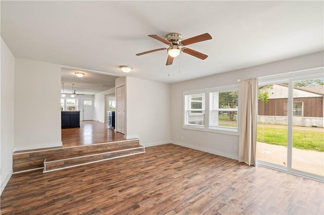 2914 Debra, Corpus Christi, TX 78418 - unfurnished living room with a wealth of natural light, baseboards, wood finished floors, and ceiling fan