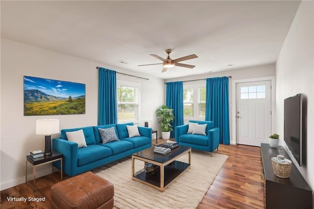 2914 Debra, Corpus Christi, TX 78418 - living area featuring wood finished floors, a healthy amount of sunlight, ceiling fan, and baseboards