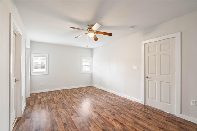 2914 Debra, Corpus Christi, TX 78418 - unfurnished bedroom with baseboards, dark wood finished floors, and multiple windows