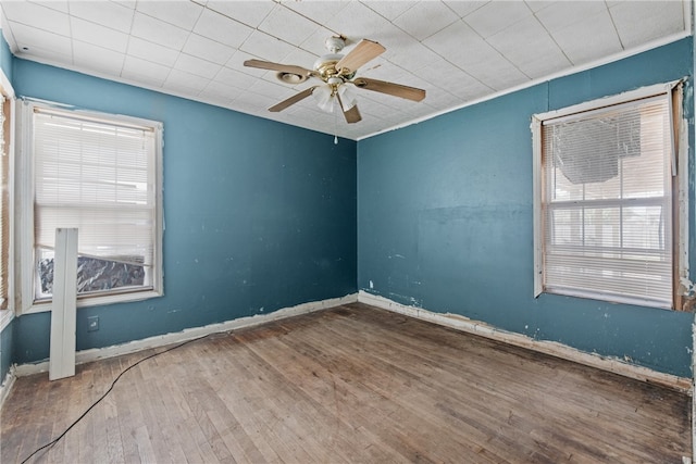 4833 Larcade Dr, Corpus Christi, TX 78415 - unfurnished room featuring wood finished floors and a ceiling fan