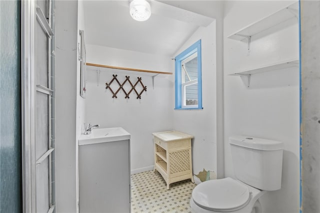 4833 Larcade Dr, Corpus Christi, TX 78415 - bathroom with tile patterned floors, vanity, and vaulted ceiling