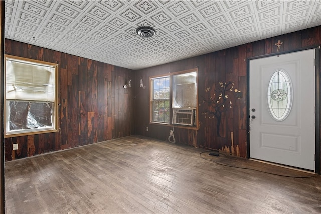 4833 Larcade Dr, Corpus Christi, TX 78415 - entryway with an ornate ceiling, wooden walls, hardwood / wood-style flooring, and cooling unit