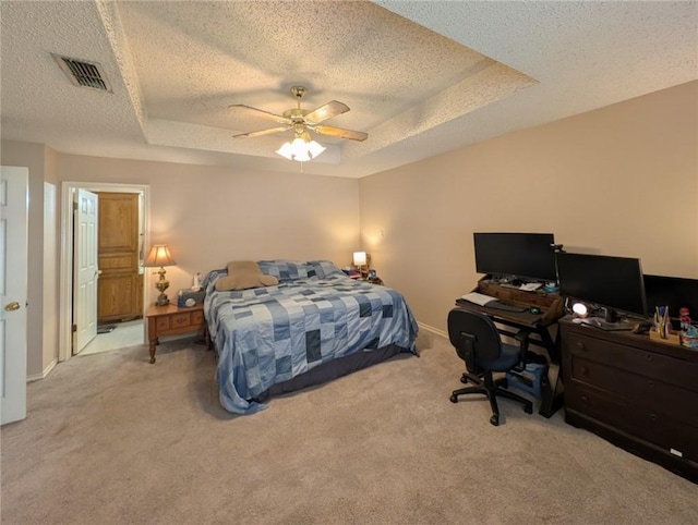 14929 Red River Dr, Corpus Christi, TX 78410 - carpeted bedroom featuring a textured ceiling, a raised ceiling, an office area, a ceiling fan, and baseboards