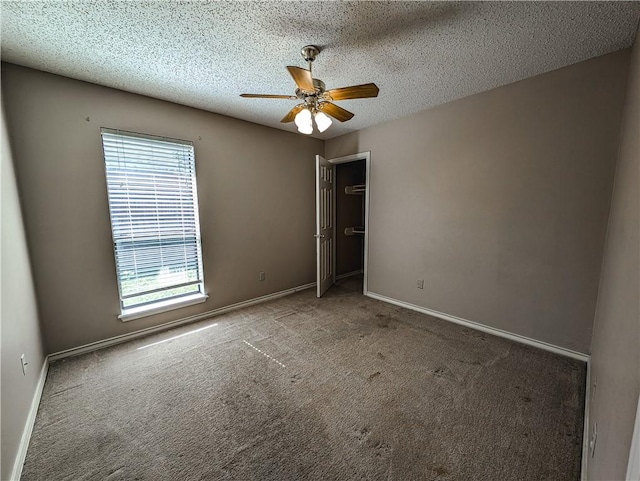 14929 Red River Dr, Corpus Christi, TX 78410 - unfurnished bedroom featuring carpet floors, a closet, a textured ceiling, and a ceiling fan