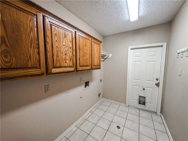 14929 Red River Dr, Corpus Christi, TX 78410 - laundry room featuring cabinet space, electric dryer hookup, light tile patterned flooring, hookup for a washing machine, and hookup for a gas dryer