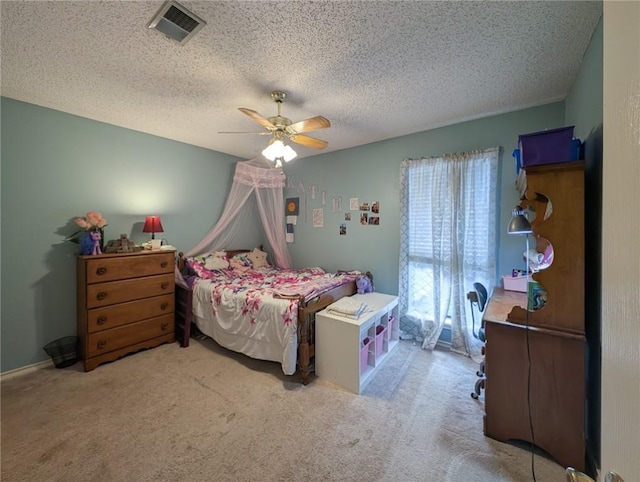 14929 Red River Dr, Corpus Christi, TX 78410 - carpeted bedroom with ceiling fan and a textured ceiling