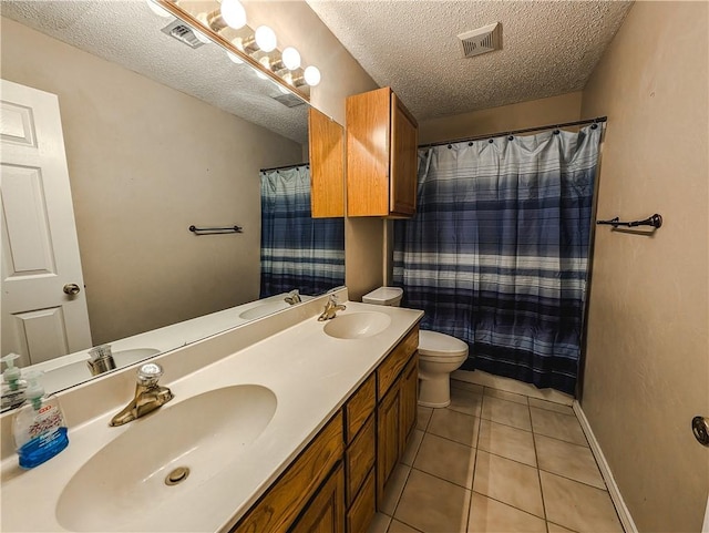 14929 Red River Dr, Corpus Christi, TX 78410 - bathroom with a textured ceiling, double vanity, tile patterned floors, and a shower with shower curtain