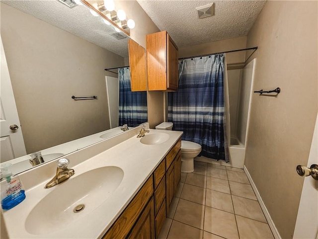 14929 Red River Dr, Corpus Christi, TX 78410 - bathroom with a textured ceiling, double vanity, tile patterned floors, and shower / bathtub combination with curtain