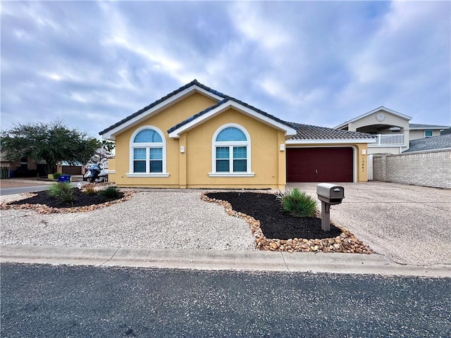 single story home with a garage