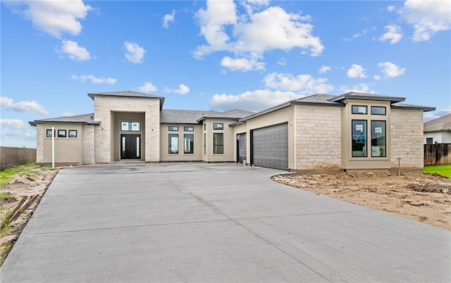 758 Buffalo Creek Dr, Corpus Christi, TX 78415 - prairie-style home featuring a garage, driveway, stone siding, and stucco siding