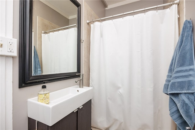 bathroom featuring vanity and crown molding