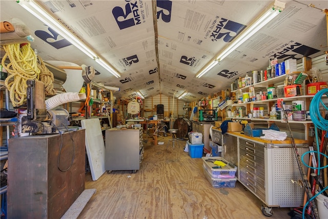 misc room with vaulted ceiling and light hardwood / wood-style flooring