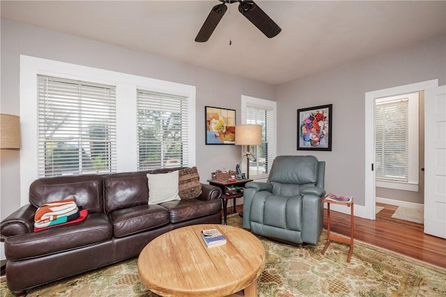 13002 State Highway 188, Sinton, TX 78387 - living area featuring a ceiling fan, wood finished floors, and baseboards