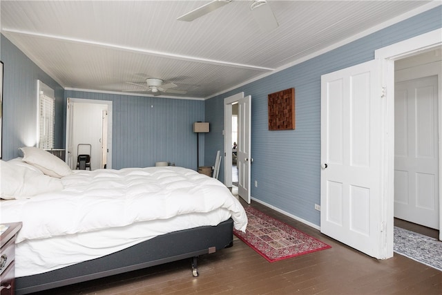 bedroom with ceiling fan, dark hardwood / wood-style floors, and crown molding