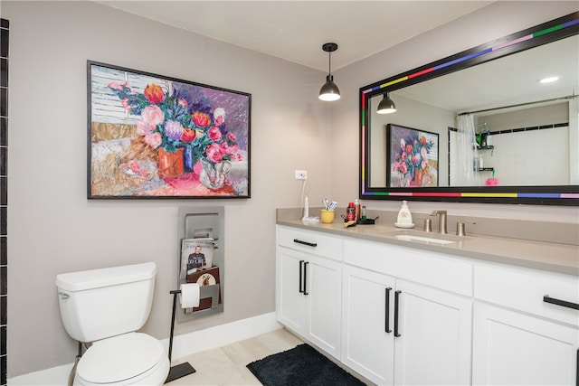 bathroom featuring a shower with curtain, vanity, and toilet