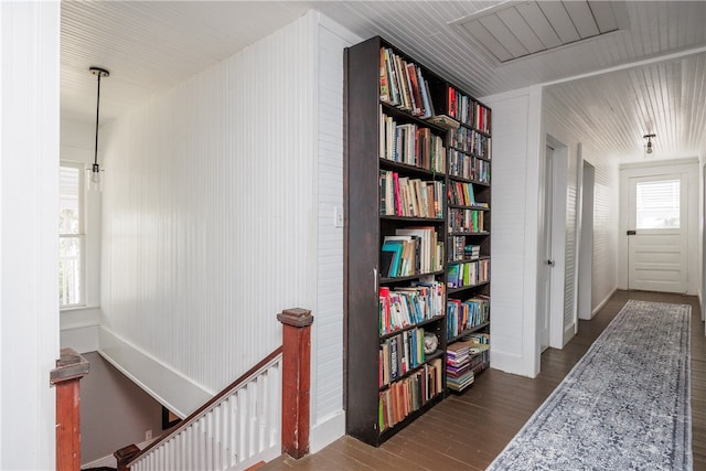 corridor featuring dark hardwood / wood-style flooring