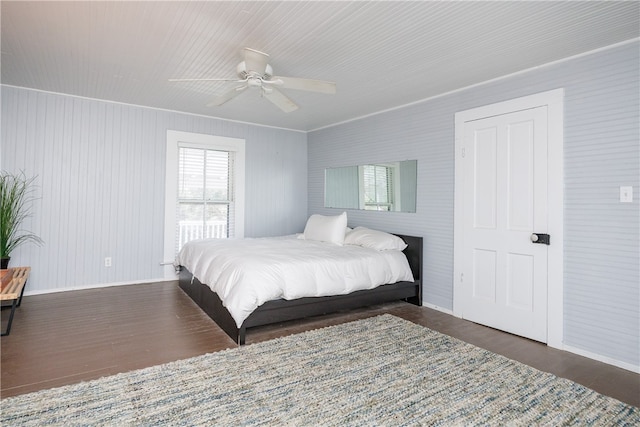 bedroom featuring ceiling fan and dark hardwood / wood-style floors