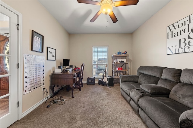 carpeted home office with ceiling fan