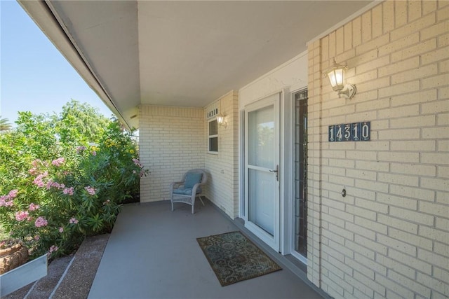 entrance to property with brick siding