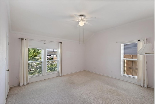 unfurnished room featuring a ceiling fan, lofted ceiling, and carpet flooring