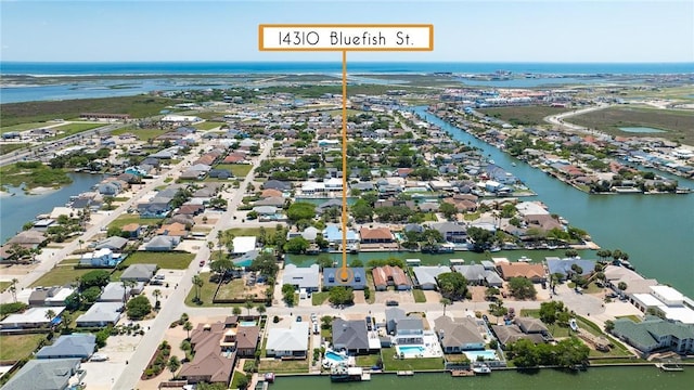 aerial perspective of suburban area with a nearby body of water