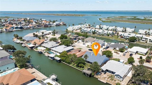 view of property location with nearby suburban area and a large body of water