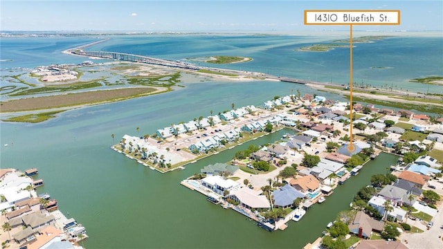 aerial overview of property's location featuring a large body of water and nearby suburban area