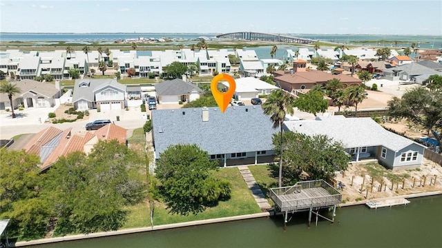 aerial view of residential area with a large body of water