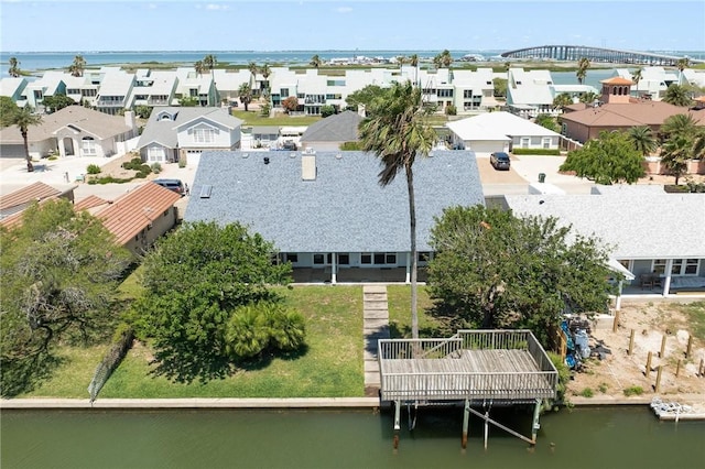 aerial perspective of suburban area with a large body of water