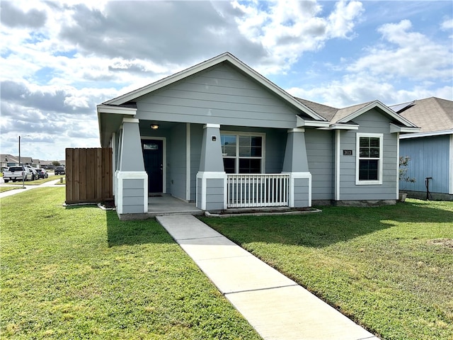 view of front of property with a porch and a front lawn