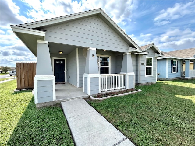 view of front facade with a porch and a front yard