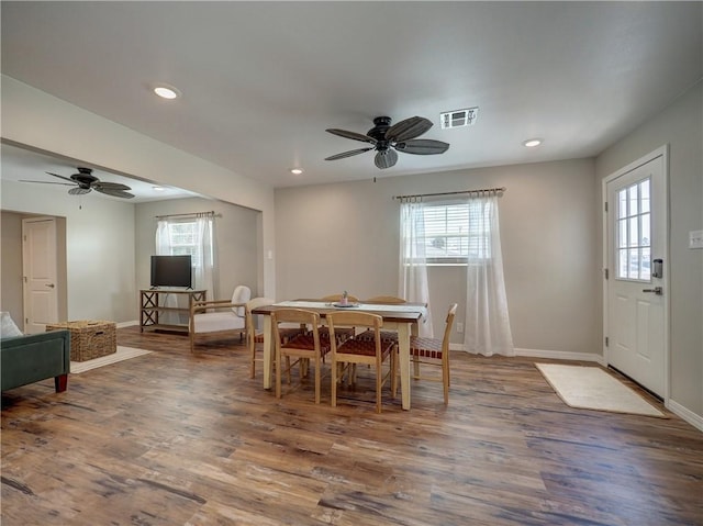 dining room featuring dark wood-type flooring and ceiling fan