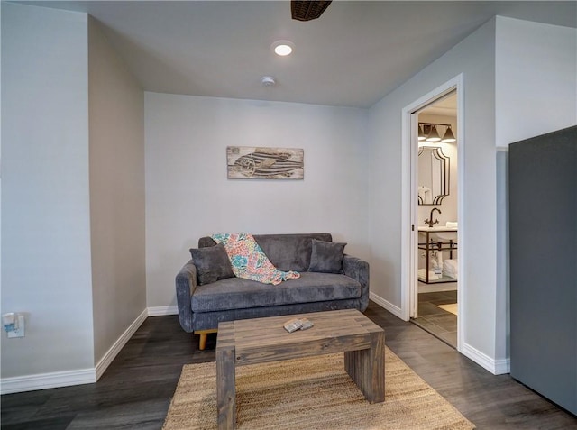 living room featuring dark wood-type flooring