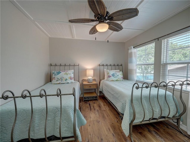 bedroom featuring wood-type flooring and ceiling fan